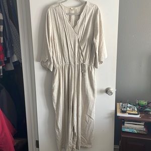 Linen jumpsuit with scalloped neckline and sleeves/tie waist/snap front closure